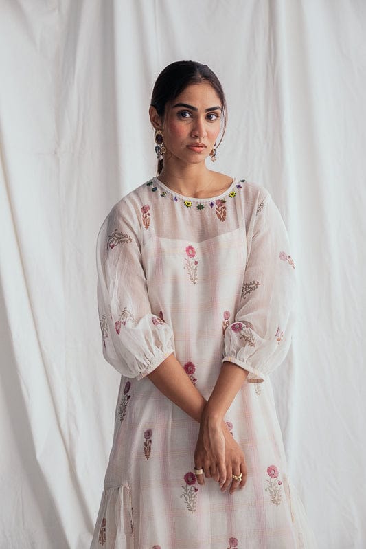 JODI Kulfi peasant dress featuring colorful floral embroidery and relaxed fit, displayed on a hanger.