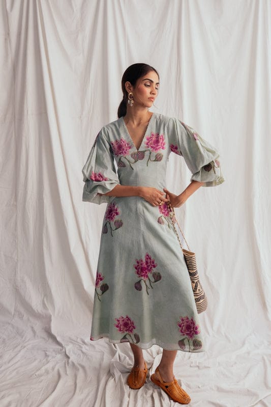 JODI Gulkand dress in soft pink fabric with elegant embroidery, displayed on a mannequin in a fashion lookbook setting.