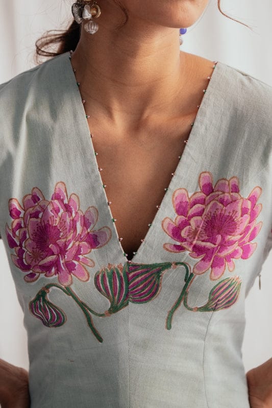 JODI Gulkand dress featuring floral patterns and elegant design, showcased on a model with flowing fabric and vibrant colors.