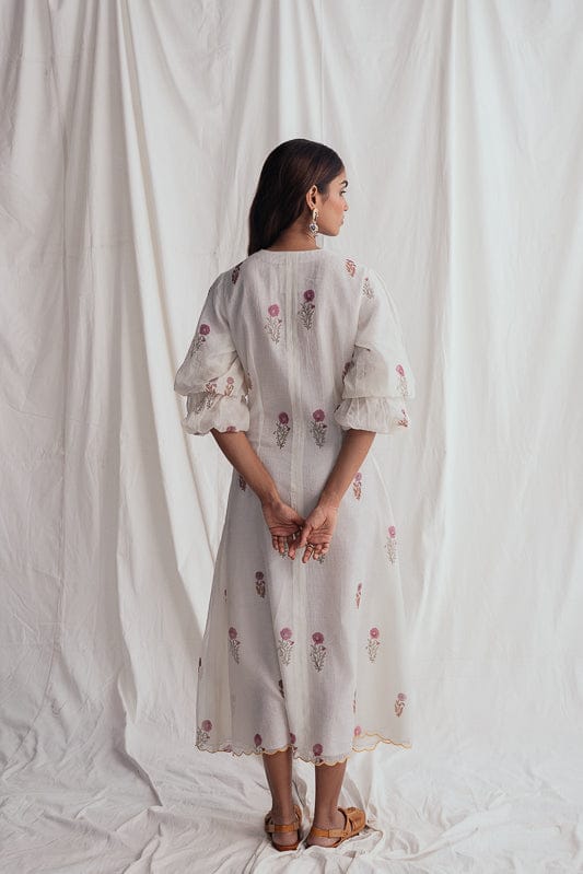 JODI Kulfi dress in vibrant fabric with intricate embroidery, featuring a flowing silhouette and elegant design.