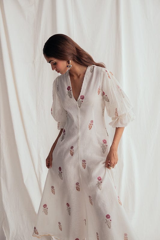 JODI Kulfi dress shown in a stylish, flowing design with intricate patterns and vibrant colors, perfect for elegant occasions.