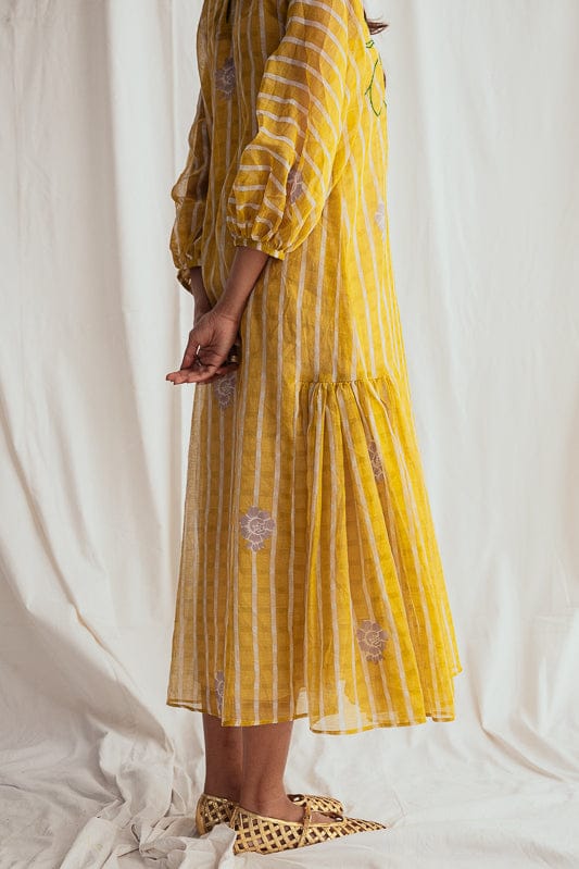 JODI Dhoop peasant dress with flowy fabric, relaxed fit, and bohemian style, featuring earthy tones and casual elegance.