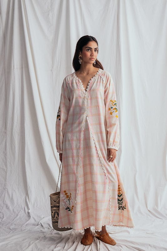 JODI Chataai peasant dress with flowing fabric and bohemian style, shown in a full-length view.