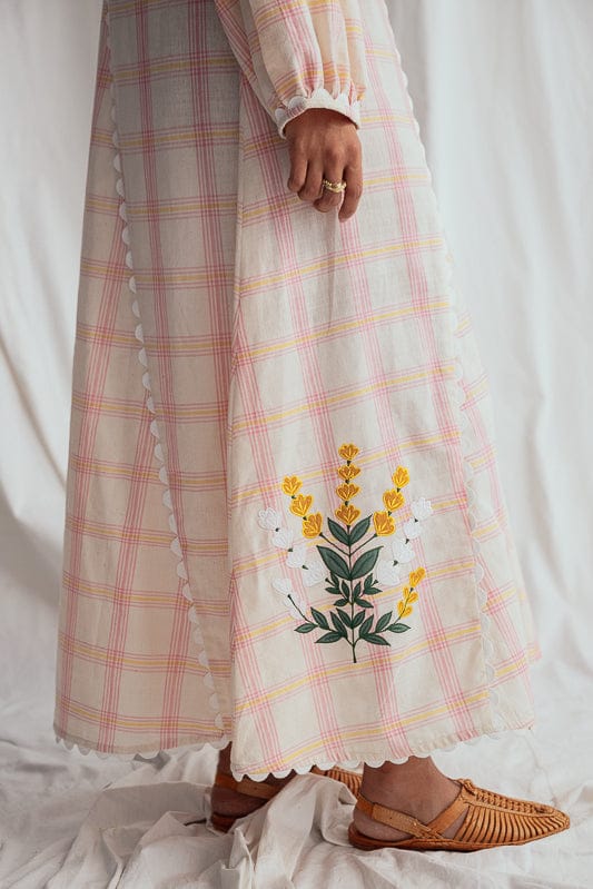 JODI Chataai peasant dress featuring flowy, boho-inspired fabric with a relaxed fit and intricate embroidery.
