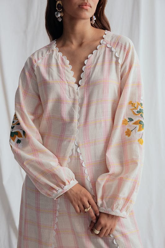 JODI Chataai peasant dress with bohemian style, featuring flowy fabric and intricate embroidery, perfect for casual wear.