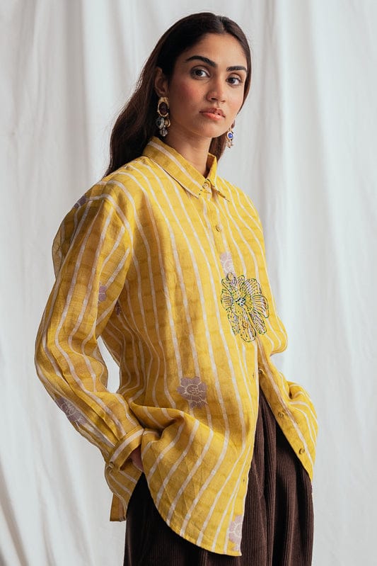 JODI Dhoop shirt featuring intricate patterns and a relaxed fit, displayed on a model in a stylish lookbook setting.