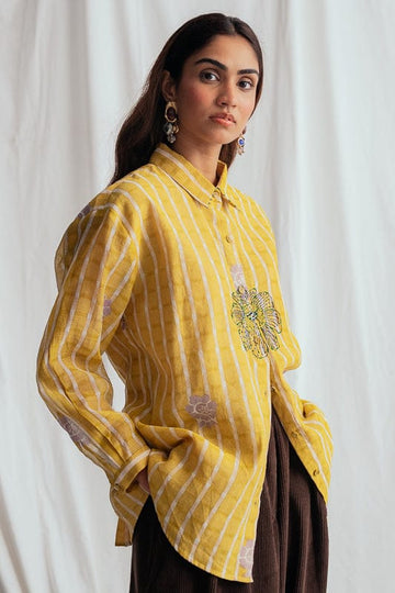 JODI Dhoop shirt featuring intricate patterns and a relaxed fit, displayed on a model in a stylish lookbook setting.