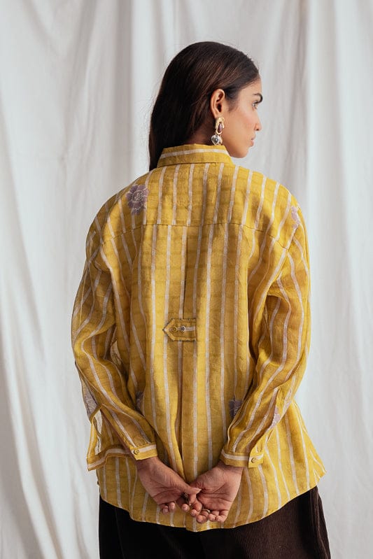 JODI Dhoop shirt displayed on a model, featuring traditional design with vibrant colors and intricate patterns.