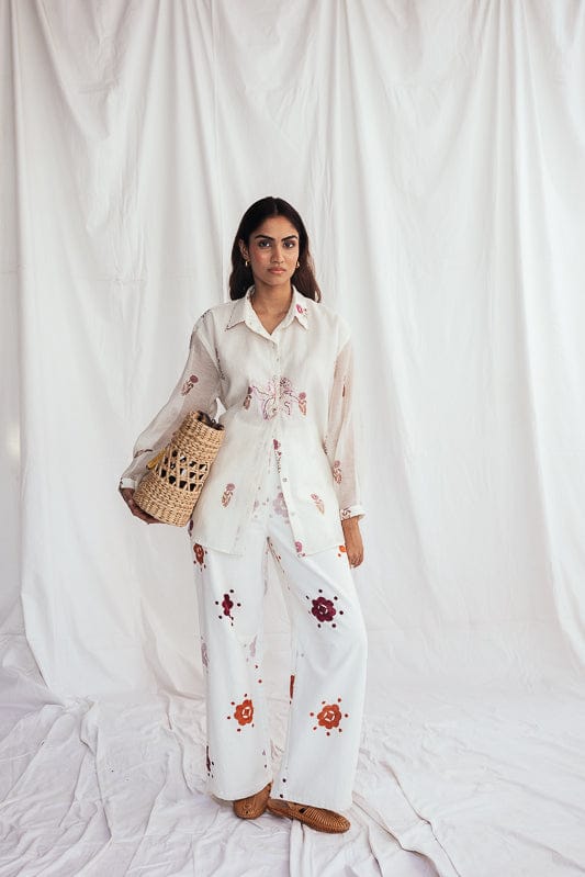 JODI Thandai corduroy trousers in a relaxed fit, shown in a neutral beige color, with visible ribbed corduroy fabric and classic design.