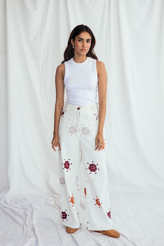 JODI Thandai corduroy trousers shown in a lookbook image, featuring a relaxed fit and rich textured fabric in warm tones.