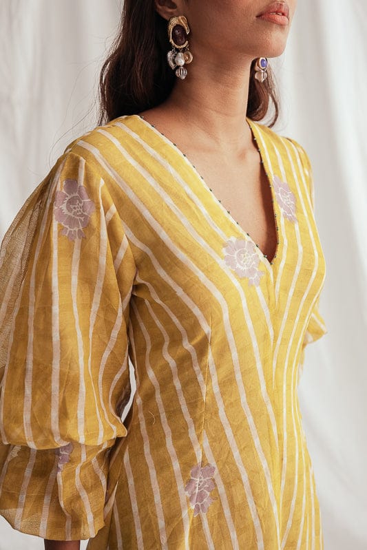 JODI Dhoop dress displayed on a model, featuring elegant design and flowing fabric, perfect for stylish occasions.
