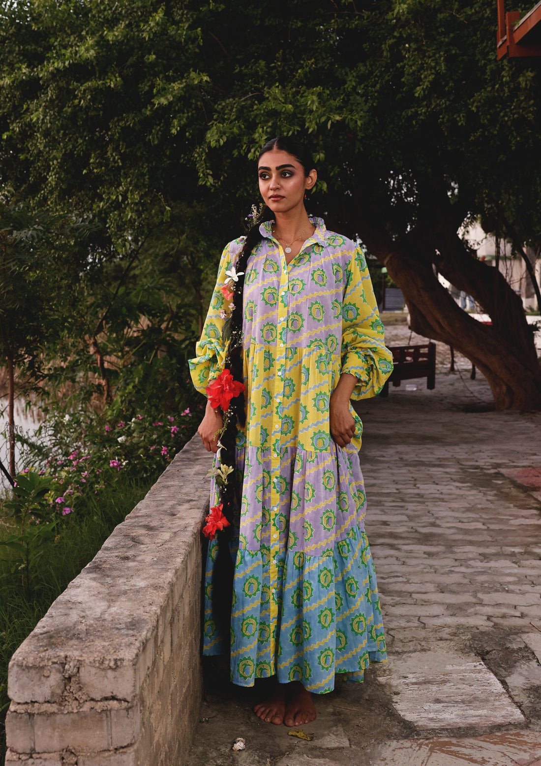 Multicolor Mango print Kakori dress by The Raw India, featuring vibrant patterns and traditional style, displayed on a hanger.
