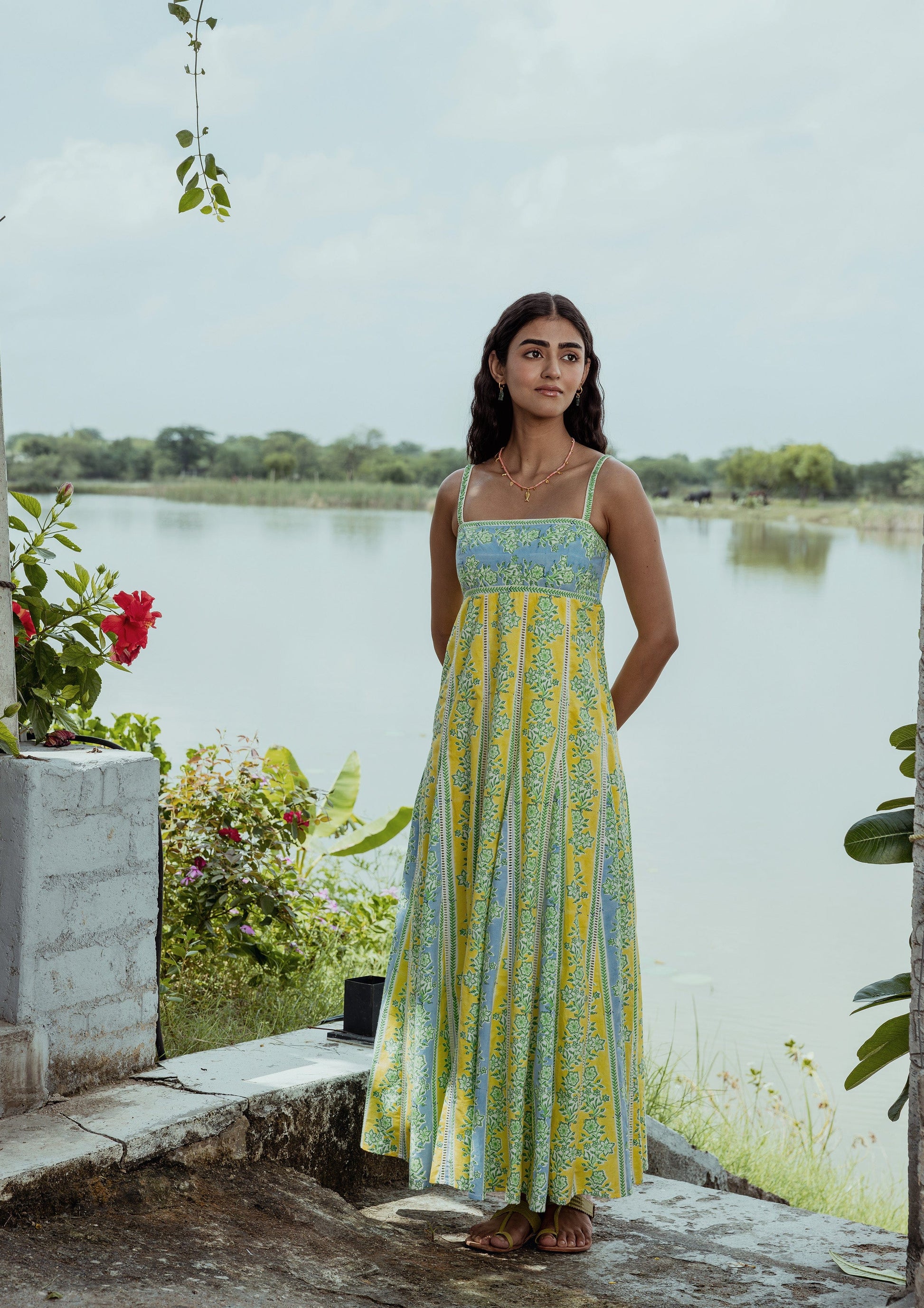 Elegant Kashi dress by The Raw India featuring chikankari embroidery and border print, displayed on a mannequin.