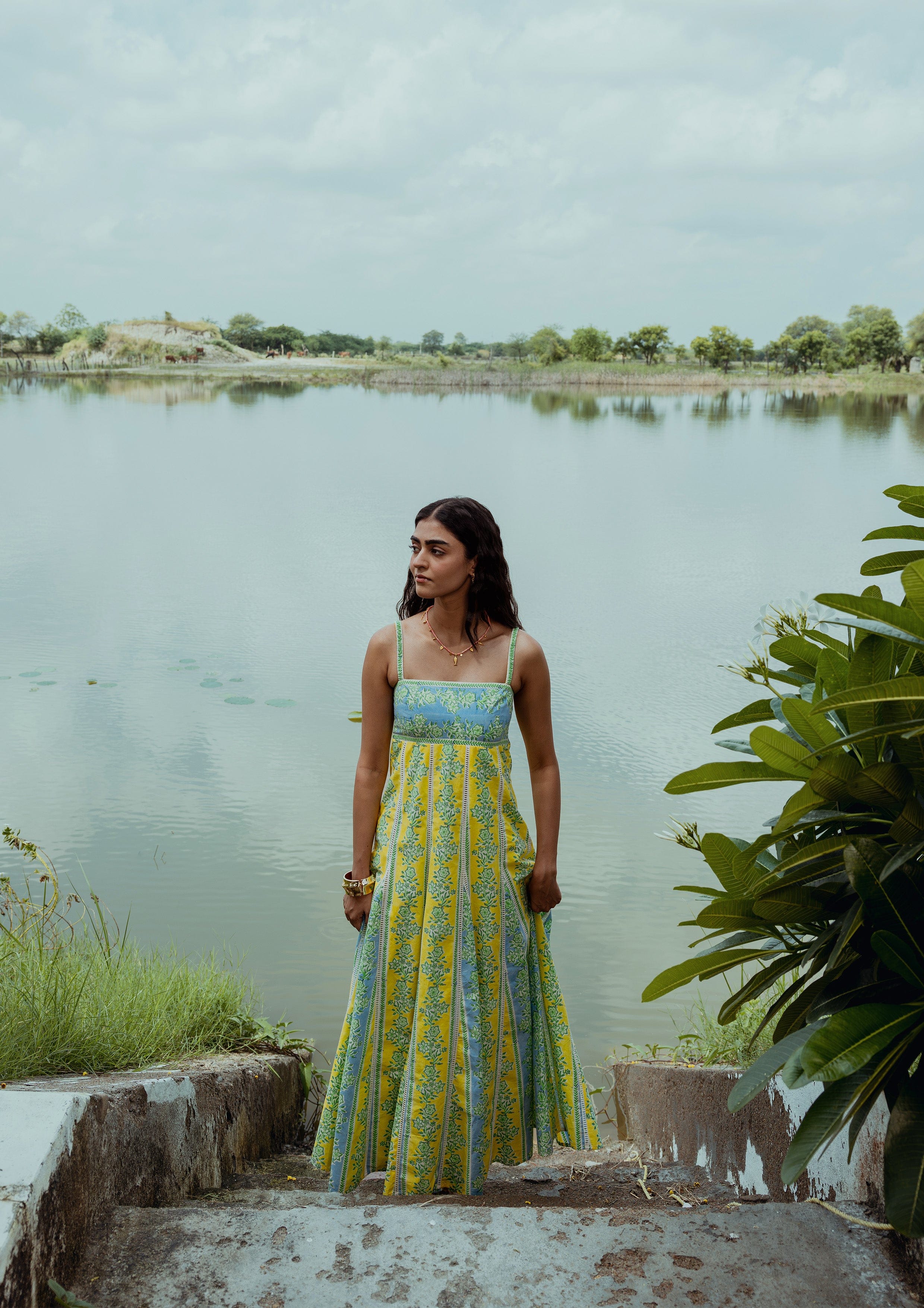 Elegant Kashi dress by The Raw India featuring chikankari embroidery and border print, showcasing intricate traditional craftsmanship.