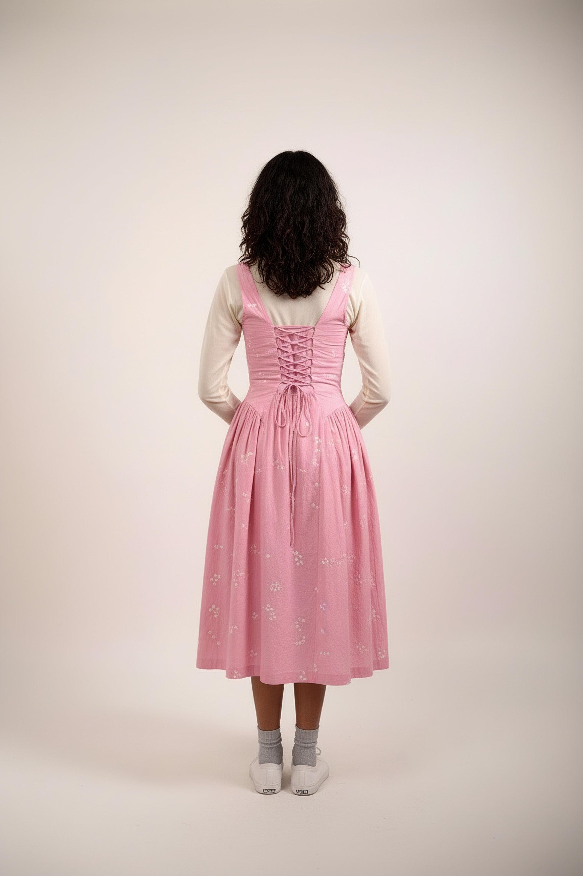 Back view of a Doodlage Kyren bandhani dress featuring traditional blue and white tie-dye patterns and a flowing silhouette.