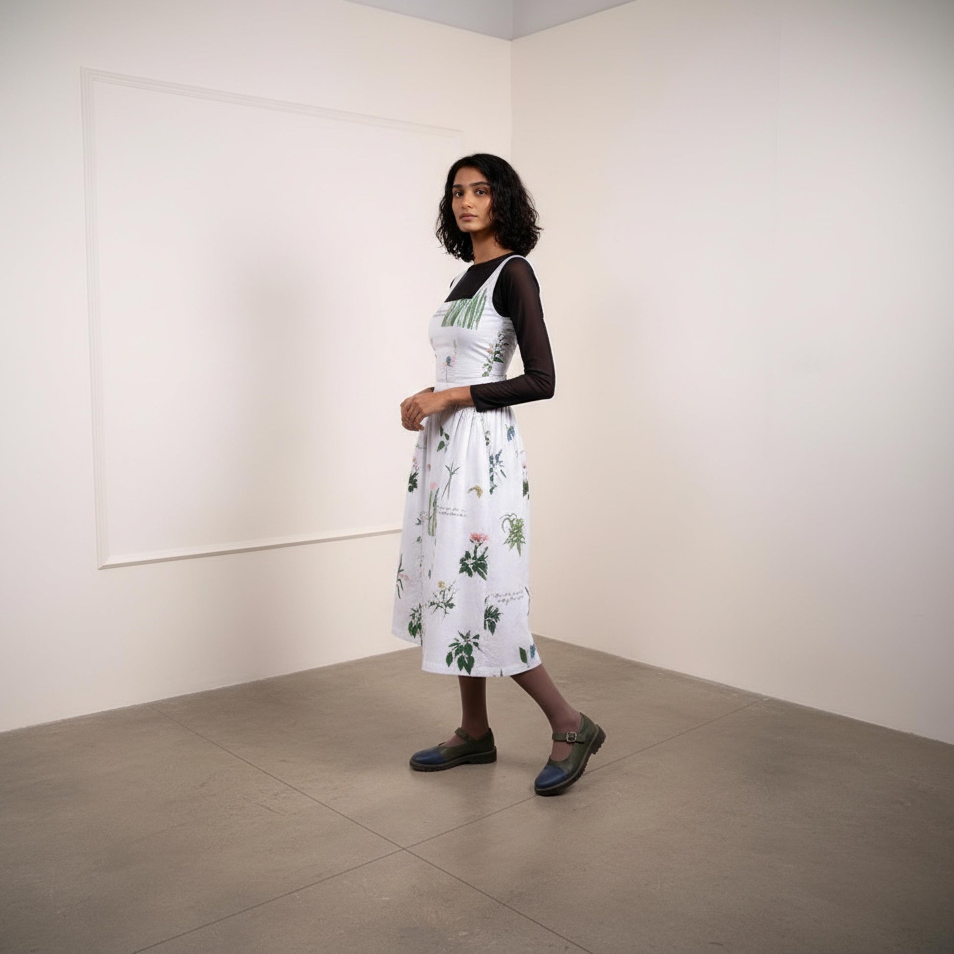 Kyren printed dress by Doodlage featuring colorful patterns and a stylish fit, showcased on a model.