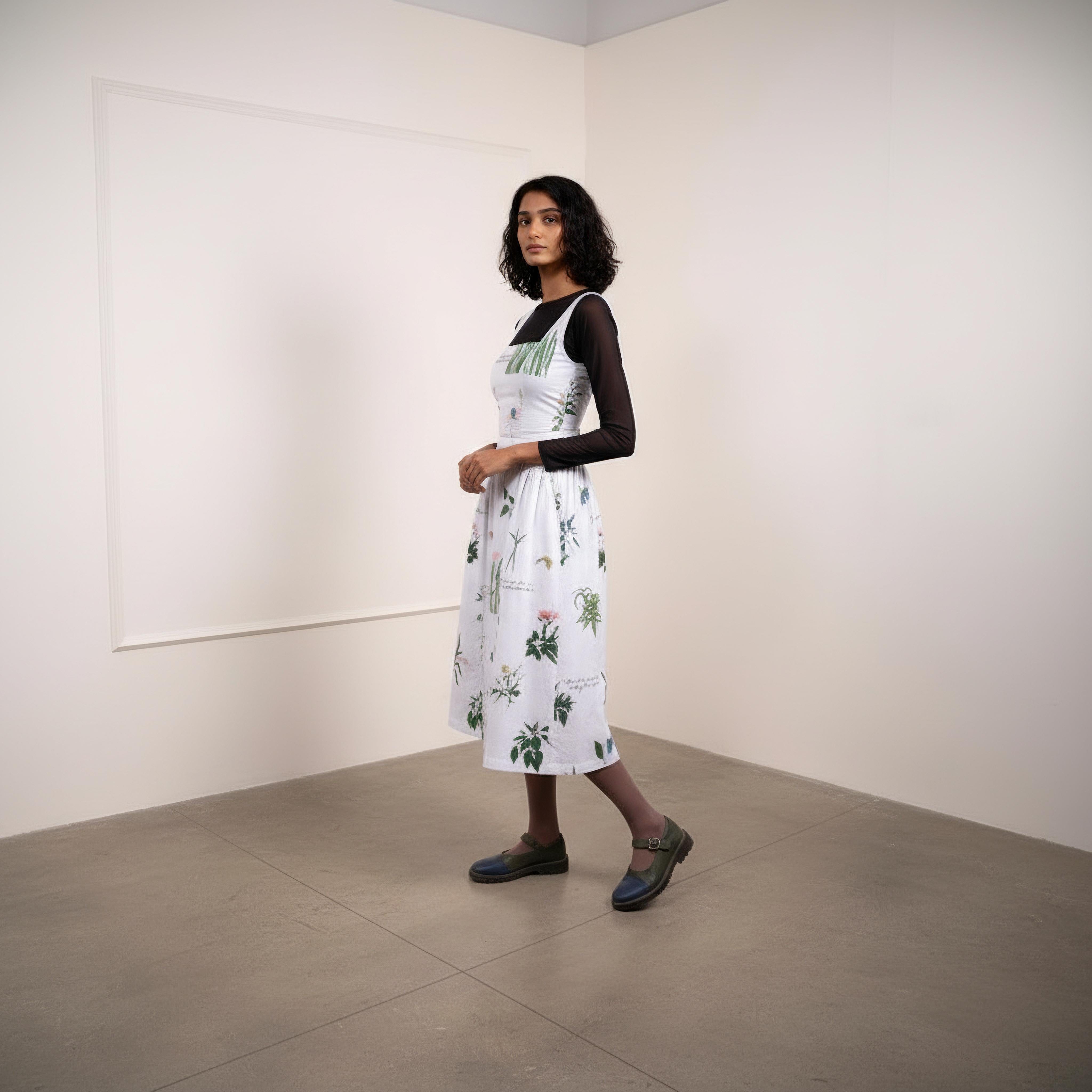 Kyren printed dress by Doodlage featuring colorful patterns and a stylish fit, showcased on a model.
