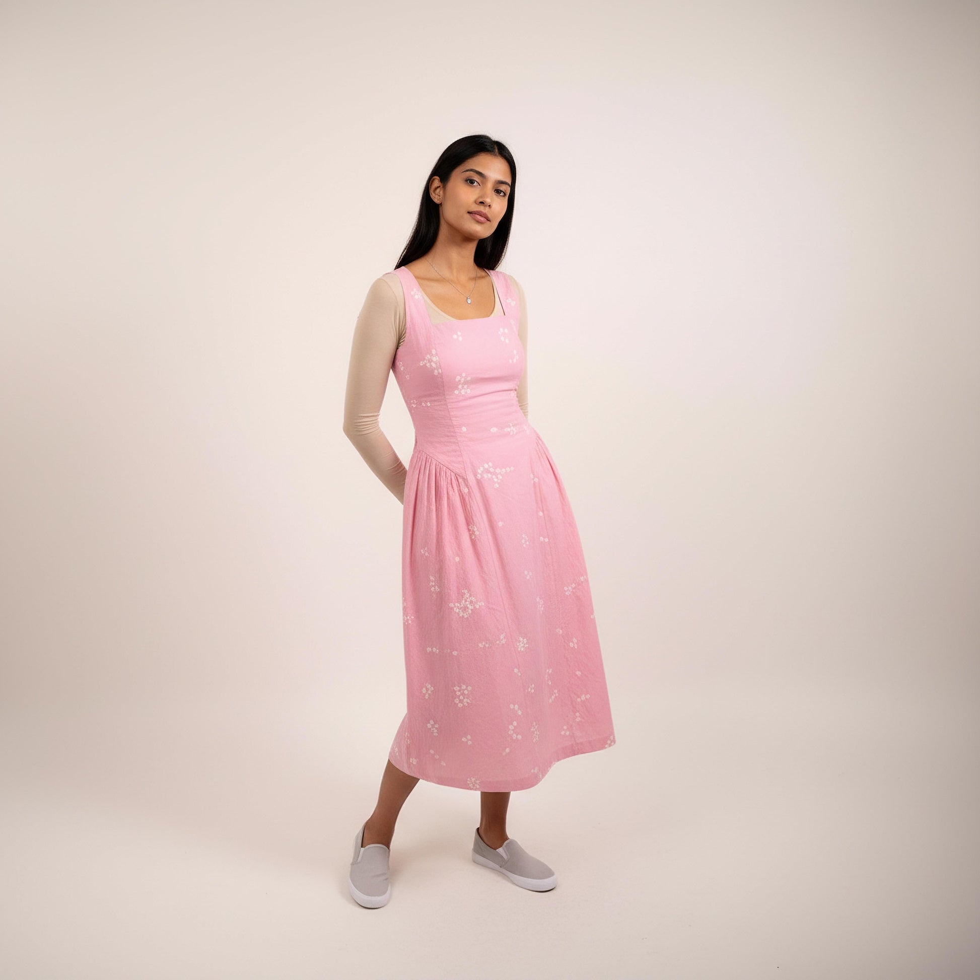 Kyren bandhani dress by Doodlage featuring vibrant traditional tie-dye patterns and a modern silhouette against a clean background.