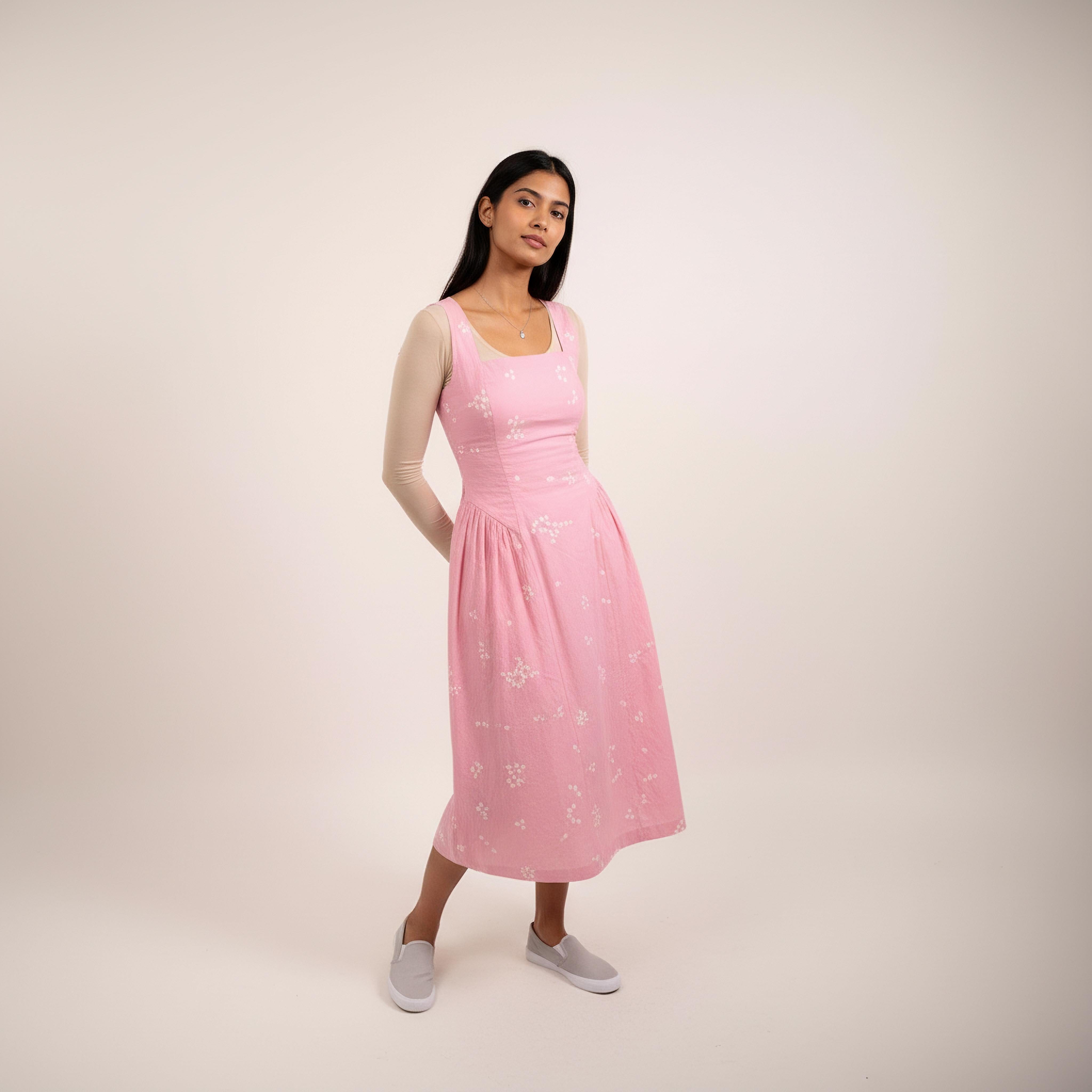 Kyren bandhani dress by Doodlage featuring vibrant traditional tie-dye patterns and a modern silhouette against a clean background.