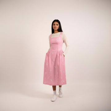 Kyren bandhani dress by Doodlage featuring traditional tie-dye patterns and vibrant colors on a clean background.