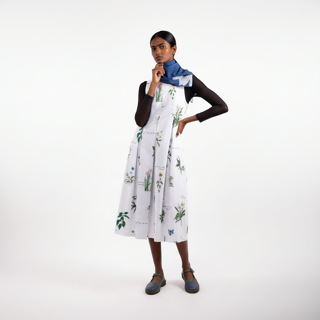 Doodlage Malaya printed dress with colorful floral pattern and flowing fabric, displayed against a neutral background.