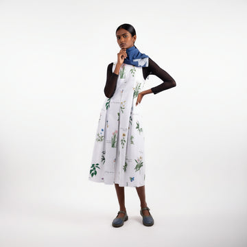 Doodlage Malaya printed dress with colorful floral pattern and flowing fabric, displayed against a neutral background.