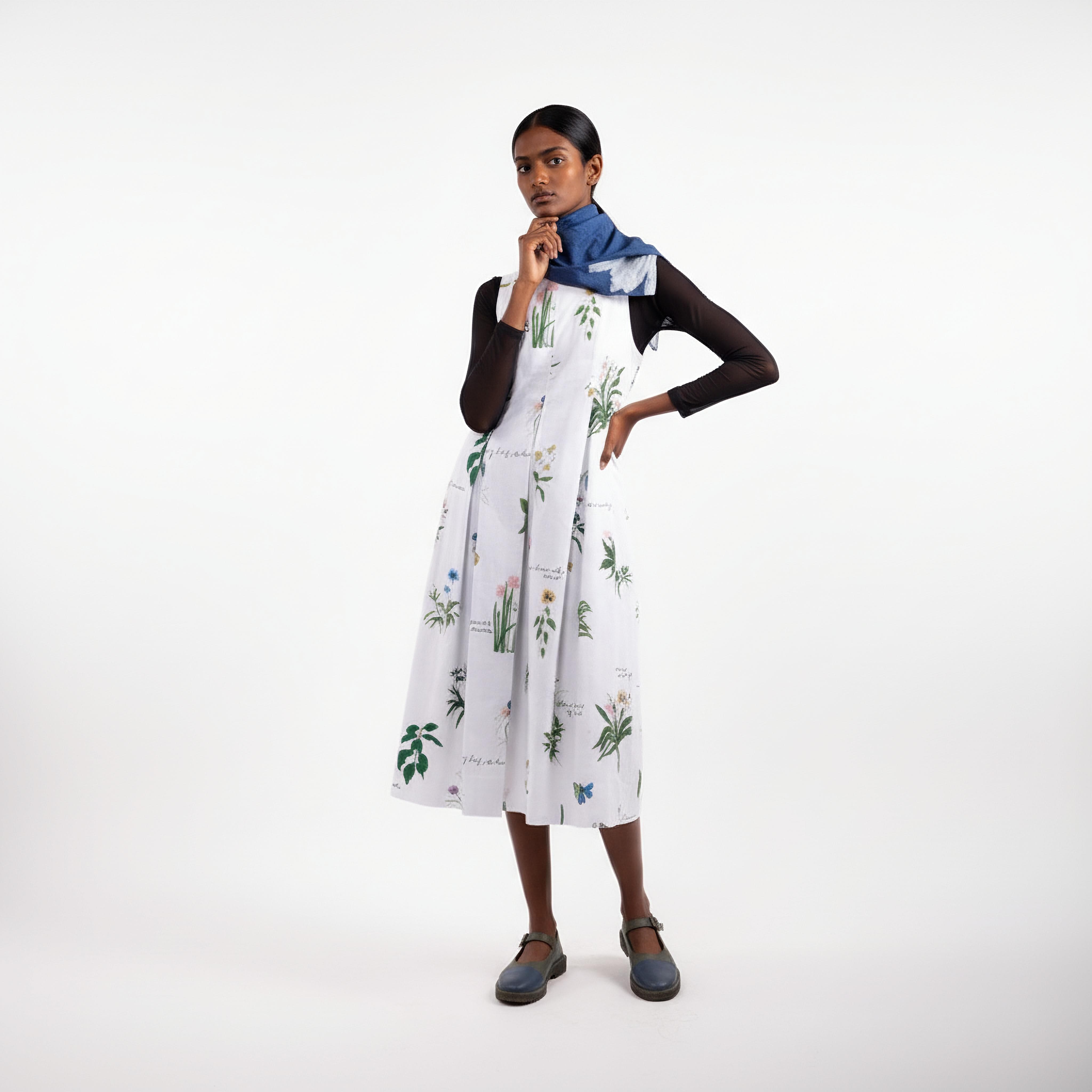 Doodlage Malaya printed dress with colorful floral pattern and flowing fabric, displayed against a neutral background.