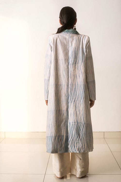 Theloomart ocean waves jacket showing a vibrant blue and white wave pattern on lightweight fabric.
