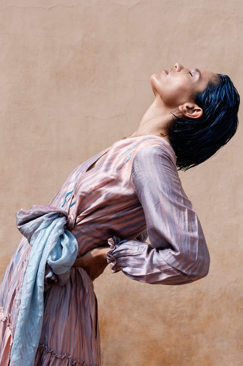 Elegant icy rust-colored dress by Theloomart with a flowing design and stylish silhouette.