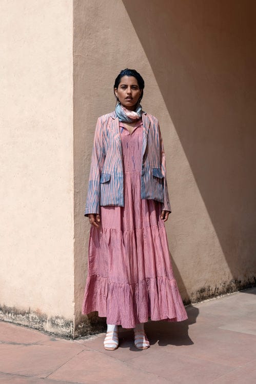 Coral silk jacket from Theloomart, showcasing smooth fabric and elegant design, with a tailored fit and stylish collar.