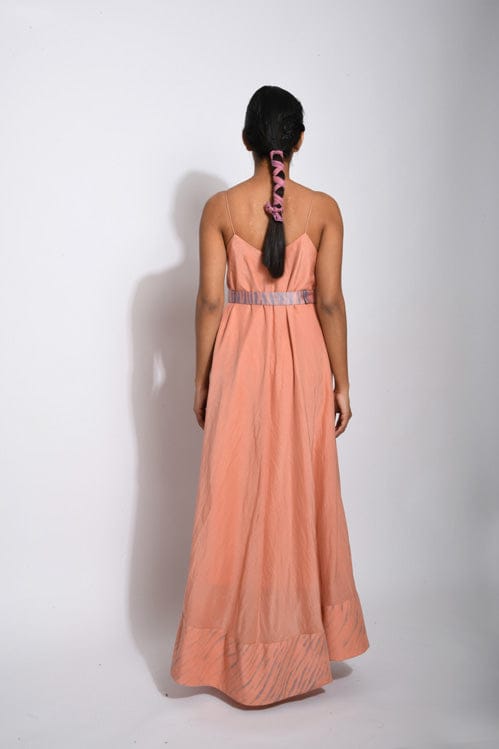 Salmon tan dress by Theloomart featuring a flowing silhouette and elegant design, displayed on a hanger.