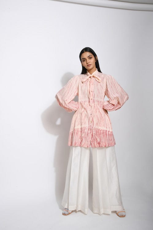 Ivory rose print shirt by Theloomart featuring a relaxed fit with floral design and button-down front.