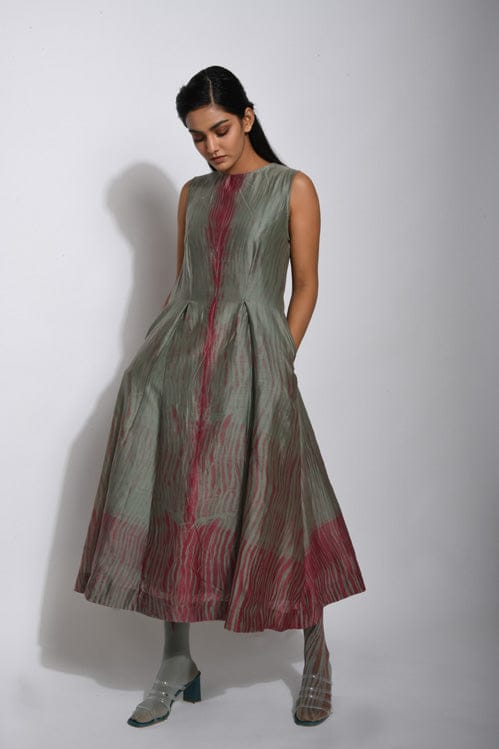 Theloomart Pickle & Wine dress with a vibrant, colorful pattern and flowing fabric, stylishly displayed on a hanger.
