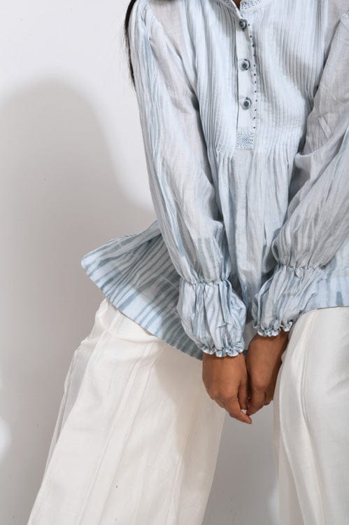Theloomart Vanilla Sky shirt featuring a soft, sky-inspired design, displayed on a hanger with a close-up of fabric texture.