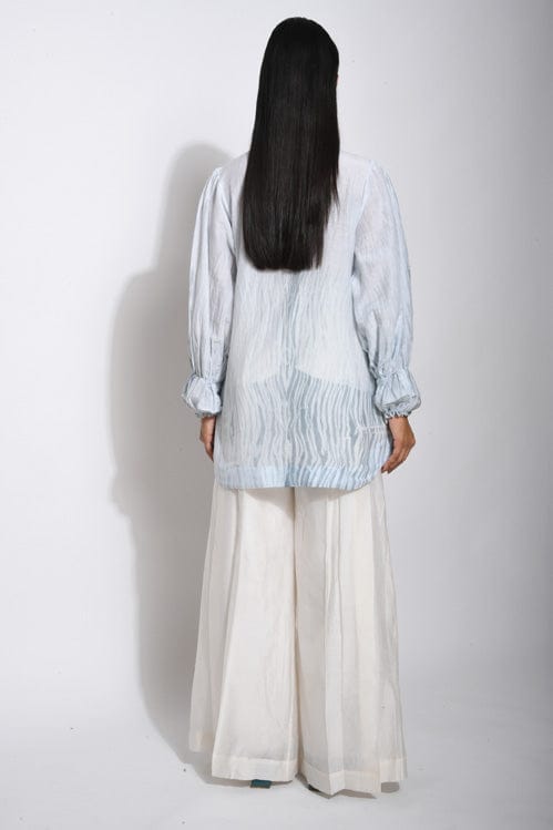 Vanilla Sky shirt by Theloomart featuring a soft, sky-blue fabric with a relaxed fit and casual style.
