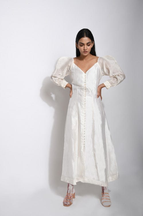 Pearl white silk dress from Theloomart featuring a flowing design and elegant fabric, perfect for formal occasions.