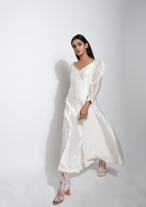Pearl white silk dress by Theloomart, featuring a flowing design and elegant fabric, displayed on a mannequin.