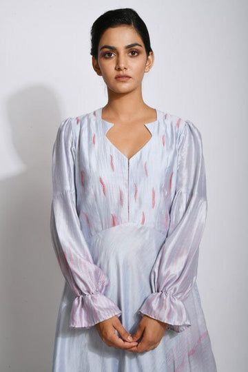 Elegant Persian silk dress by Theloomart featuring intricate patterns and flowing fabric, perfect for formal occasions.