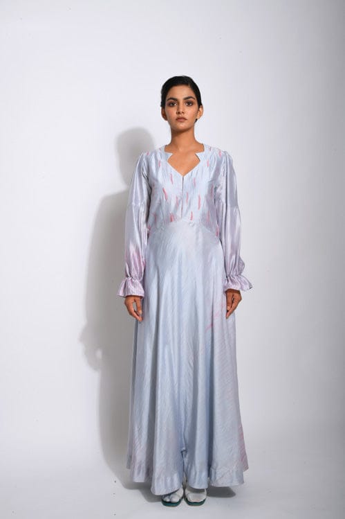 Elegant Persian silk dress by Theloomart featuring intricate patterns and flowing fabric, showcased on a dress form.