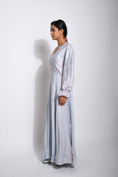 Elegant Persian silk dress by Theloomart featuring intricate patterns and flowing fabric in rich, vibrant colors.