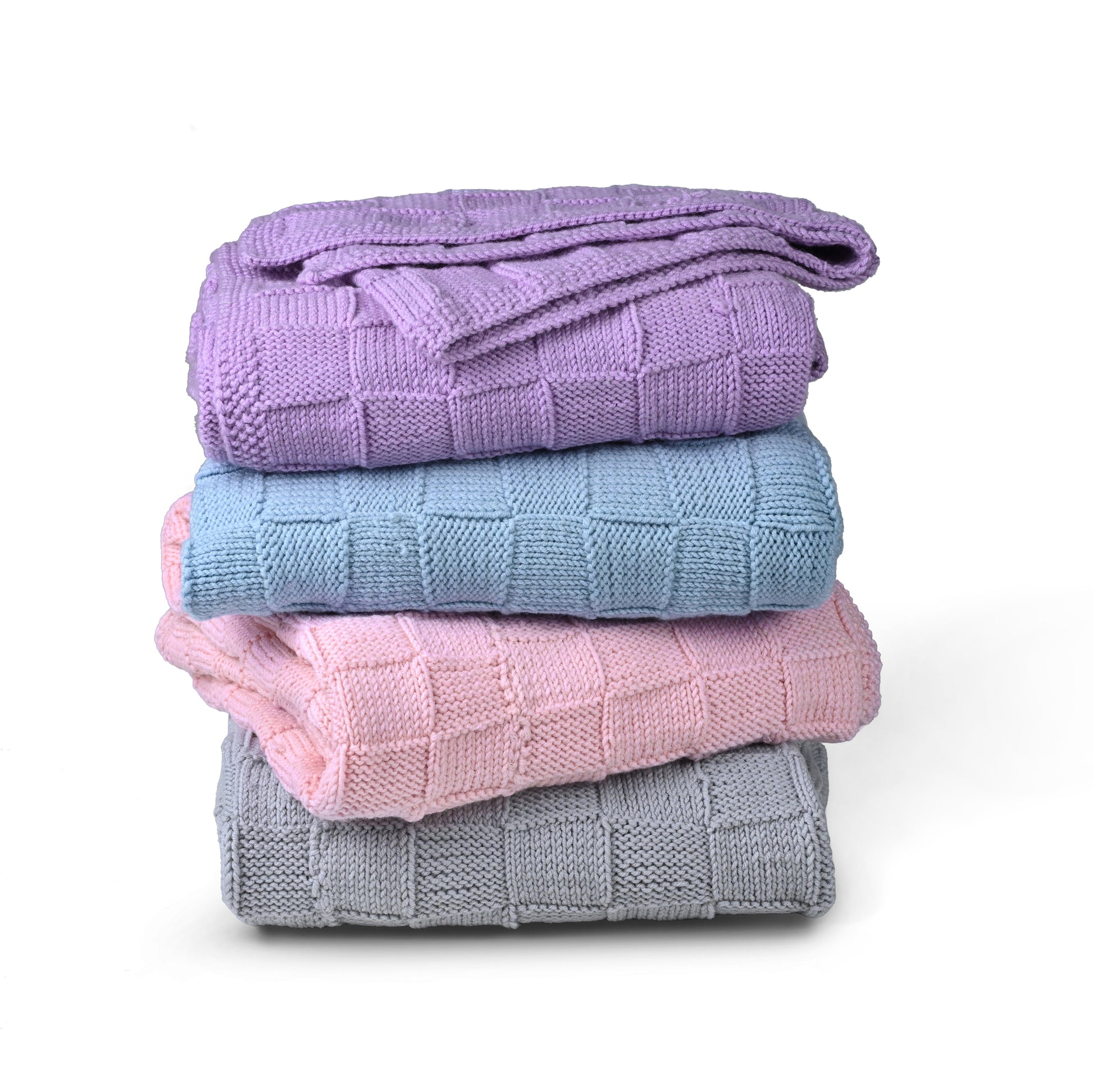 Purple Merino wool blanket by Masaya Home, soft and cozy with a plush texture, draped over a bed or sofa.