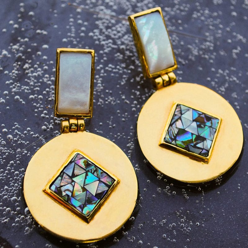 Bombaybirds Mya earrings featuring elegant gold-tone dangle design with intricate detailing and hoop accents.