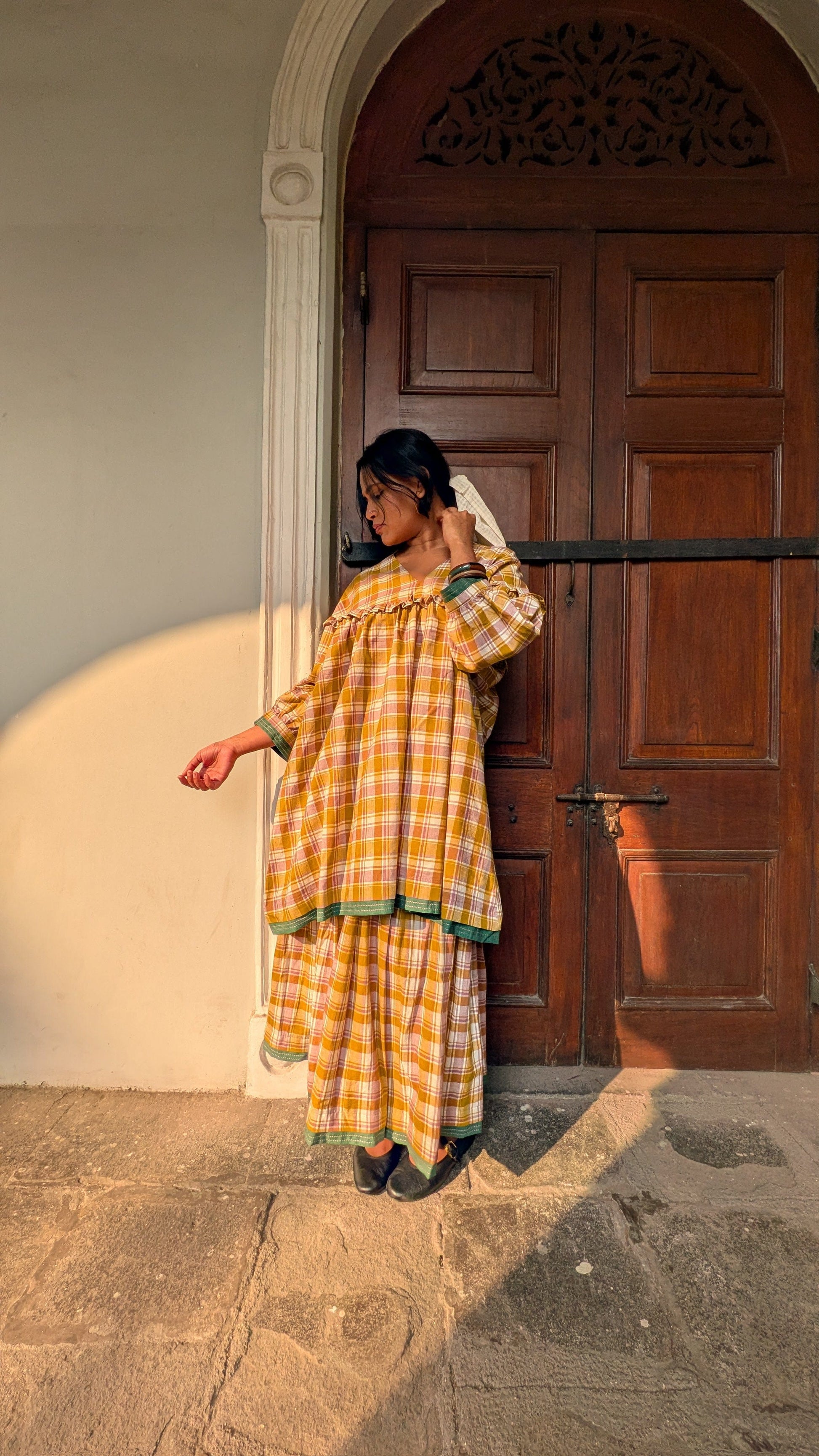 Deeta Ella tunic top with a relaxed fit, featuring a soft fabric and stylish design, displayed on a hanger.