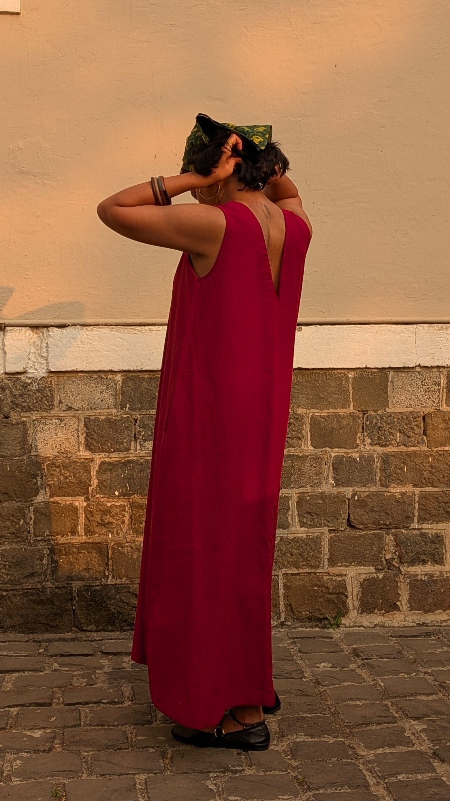Deeta Ruby dress in vibrant red fabric, featuring a stylish fit-and-flare design and elegant detailing.