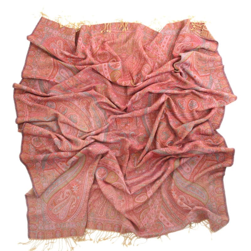 Pink Kyri throw blanket from Bombaybirds, cozy living room accessory with soft, vibrant pink fabric and textured design.