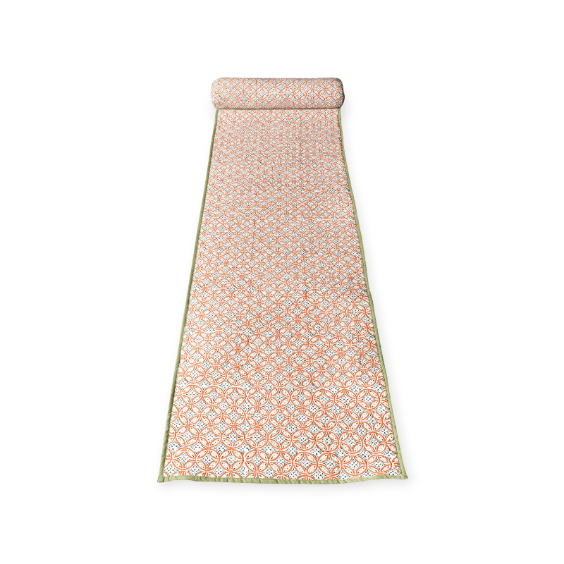 Pista beach mat by Bombaybirds featuring a vibrant green outdoor mat laid out on sandy beach with seashells.
