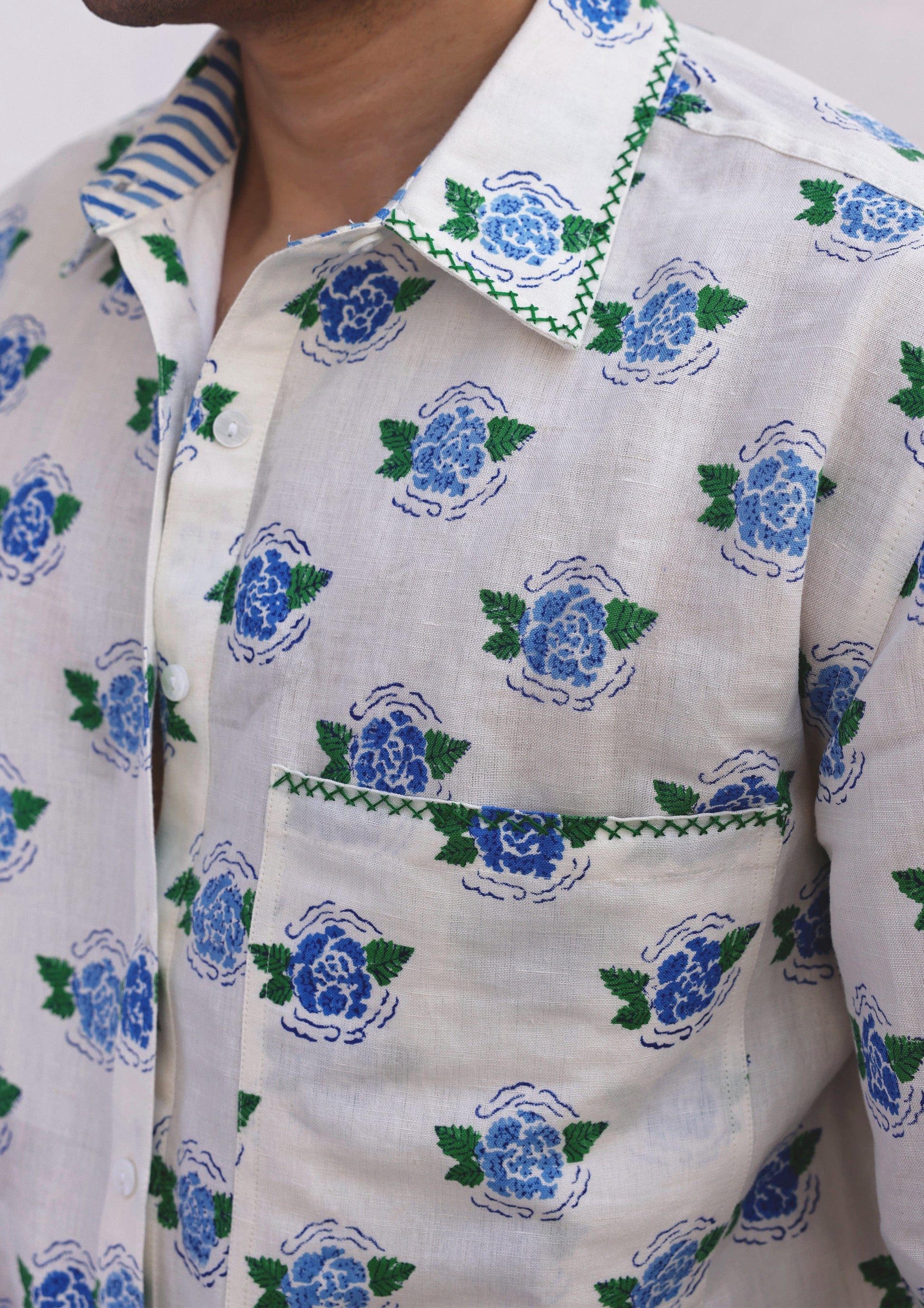 Blue Sawai shirt from The Raw India featuring vibrant marigold accents, casual tops with intricate detailing.