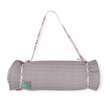 Bombaybirds sandy beach mat laid out on sand, showcasing its durable, woven outdoor design perfect for beach outings and lounging.