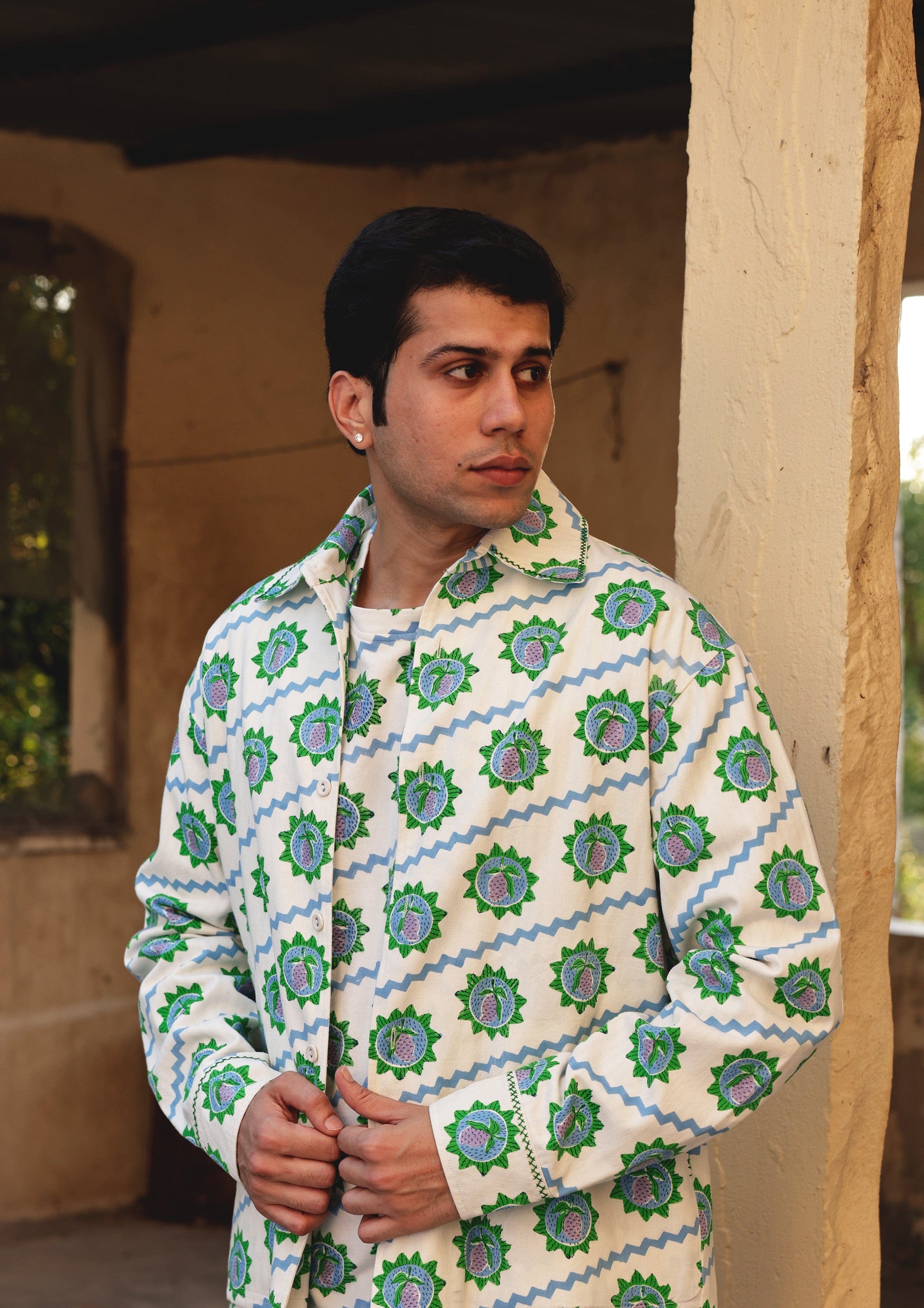 Blue Terai Jacket by The Raw India, stylish men's jacket with detailed design, shown on a hanger.