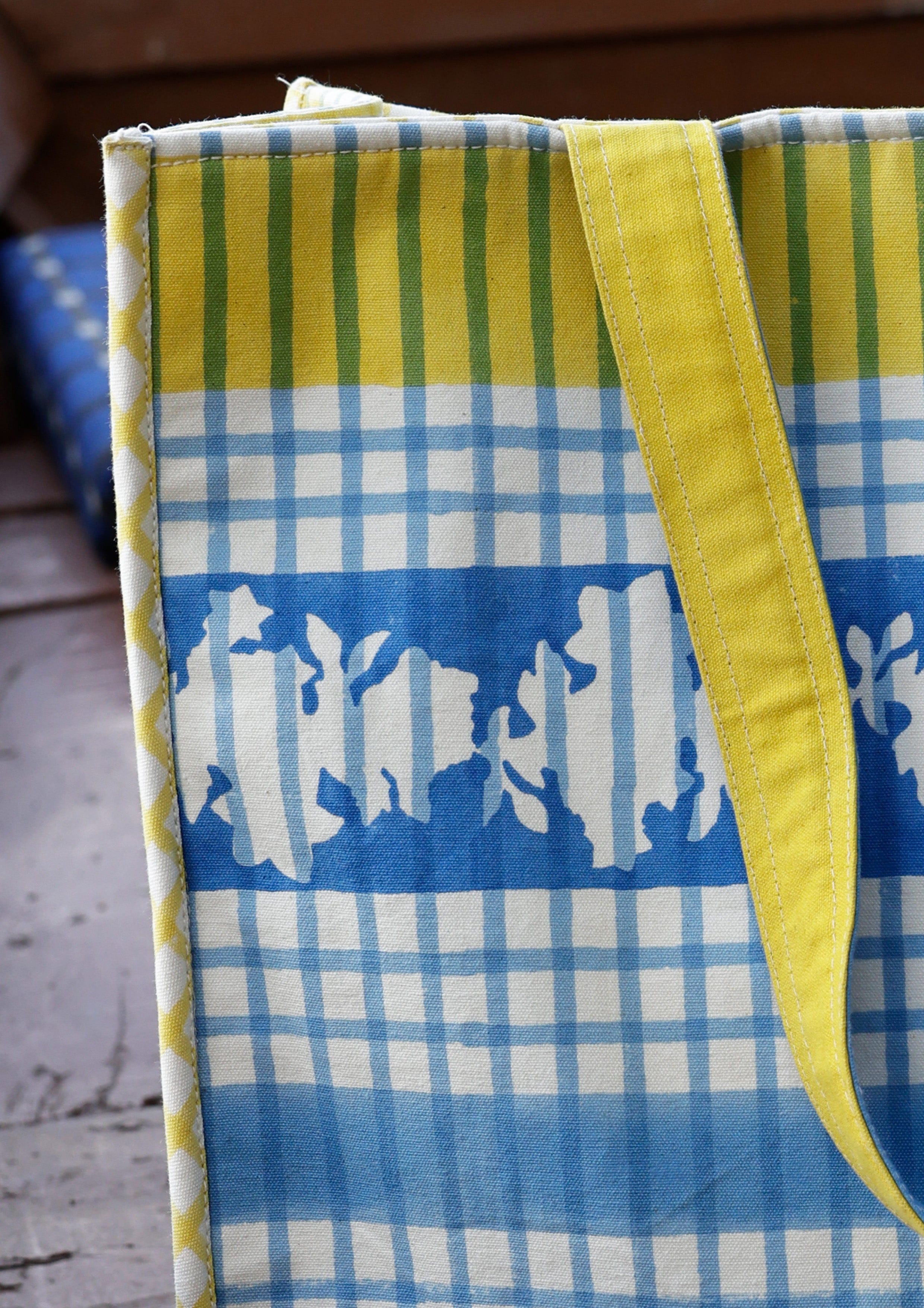 Blue checks tote bag from The Raw India featuring sturdy fabric and spacious interior for everyday use.